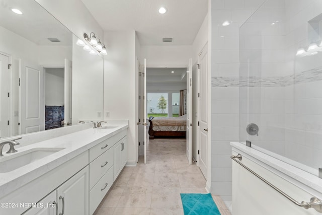 bathroom featuring tile patterned floors and vanity