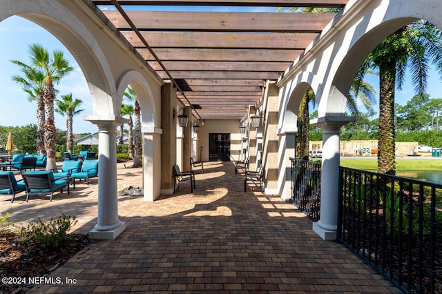 view of patio with a pergola and an outdoor living space