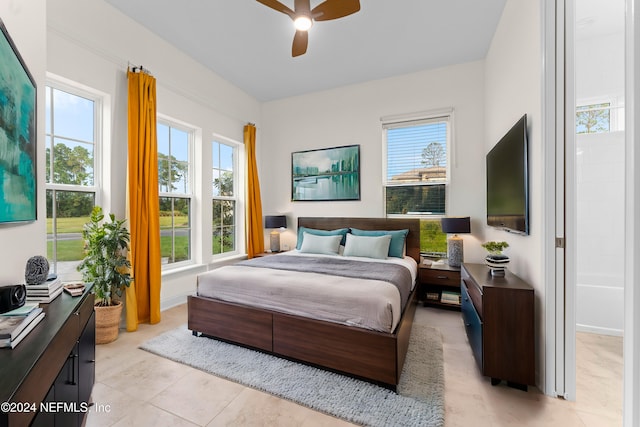 bedroom featuring ceiling fan and light tile patterned floors