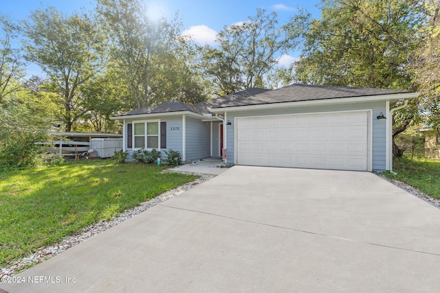 ranch-style house with a front lawn and a garage