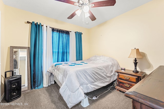 bedroom with ceiling fan and carpet