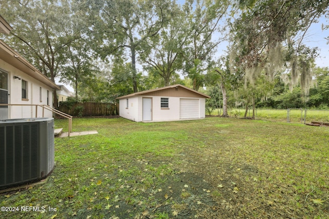 view of yard featuring an outdoor structure and cooling unit