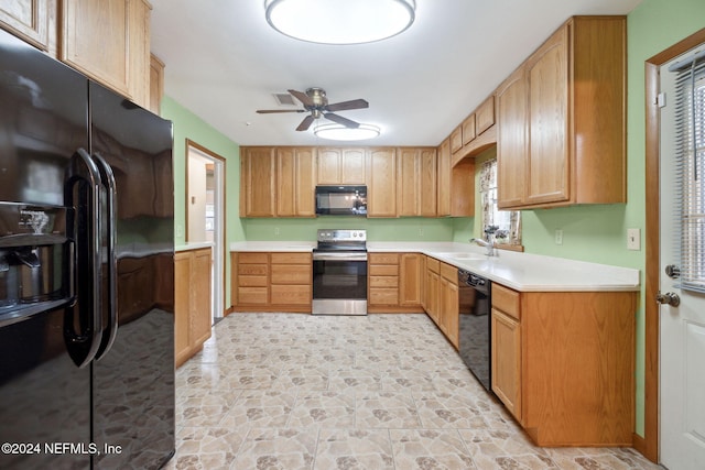 kitchen featuring black appliances, ceiling fan, and sink