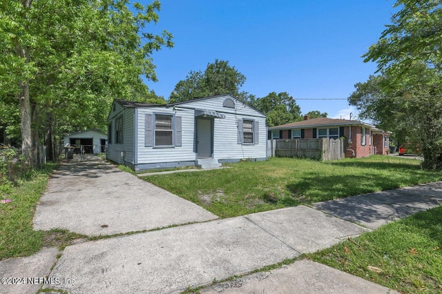 bungalow-style house with a front yard