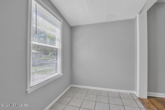 2112 Prospect St, Jacksonville, FL 32254 - unfurnished room with a textured ceiling, baseboards, and light tile patterned floors