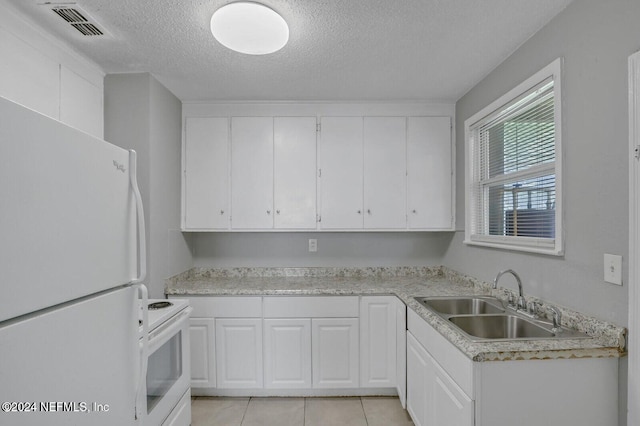 kitchen featuring a textured ceiling, white appliances, sink, and white cabinets