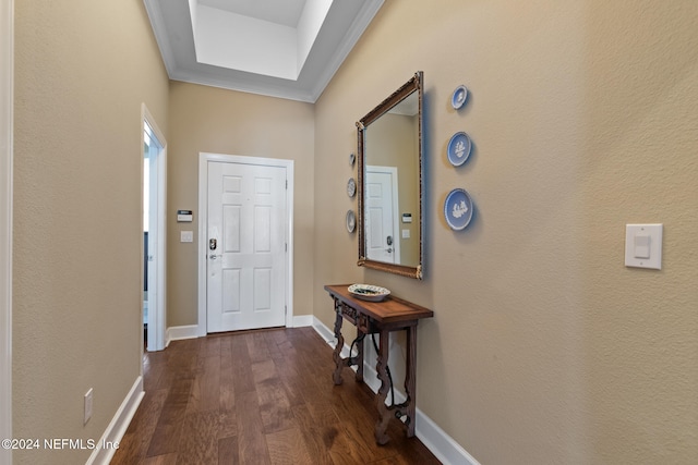 interior space with dark hardwood / wood-style flooring and ornamental molding