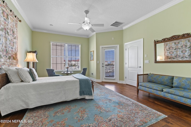 bedroom featuring ornamental molding, a textured ceiling, access to exterior, dark hardwood / wood-style flooring, and ceiling fan