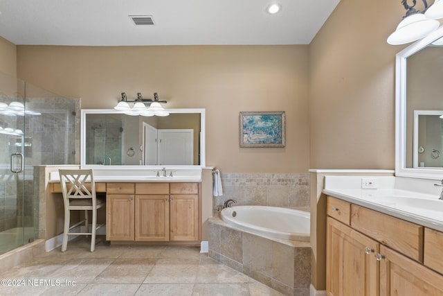 bathroom with tile patterned flooring, vanity, and plus walk in shower