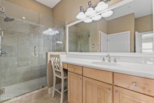 bathroom featuring walk in shower, tile patterned flooring, and vanity