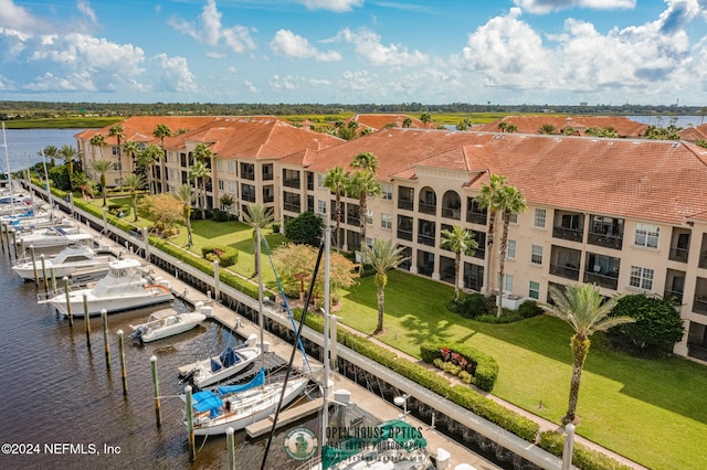 birds eye view of property with a water view