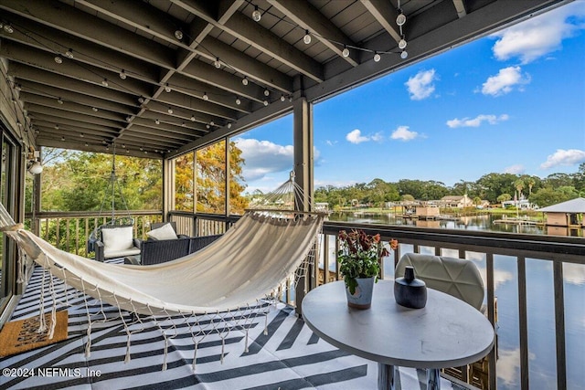 balcony featuring a water view