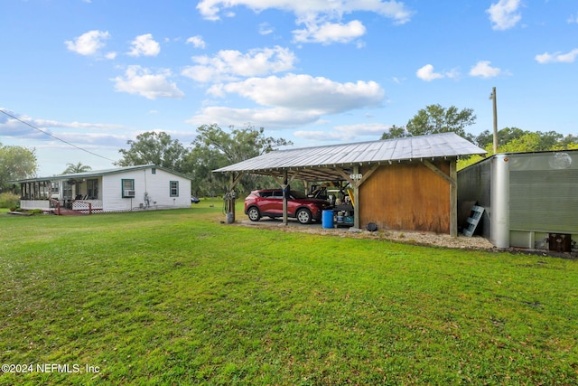 521 State Rd 207, East Palatka, FL 32131 - view of parking / parking lot featuring a detached carport