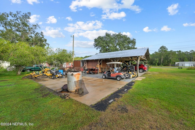 exterior space featuring a yard and a carport