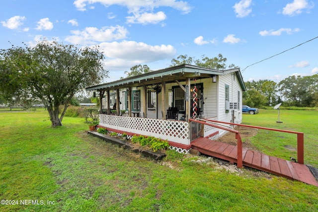 exterior space with a lawn and covered porch