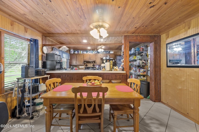 521 State Rd 207, East Palatka, FL 32131 - dining room with wood ceiling, wooden walls, and light tile patterned flooring