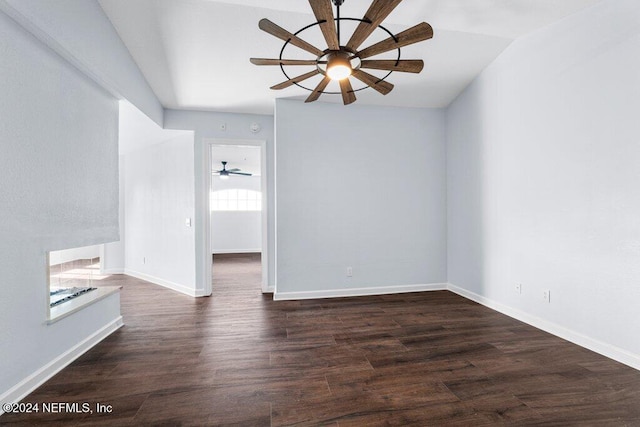 unfurnished room featuring lofted ceiling, ceiling fan, and dark wood-type flooring