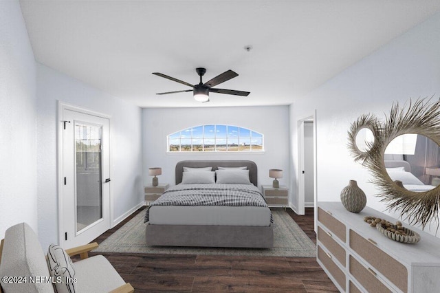 bedroom with dark hardwood / wood-style flooring and ceiling fan