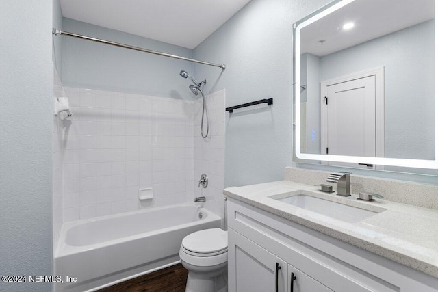 full bathroom with shower / bathing tub combination, vanity, toilet, and wood-type flooring