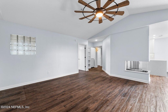 spare room featuring ceiling fan, lofted ceiling, and dark wood-type flooring