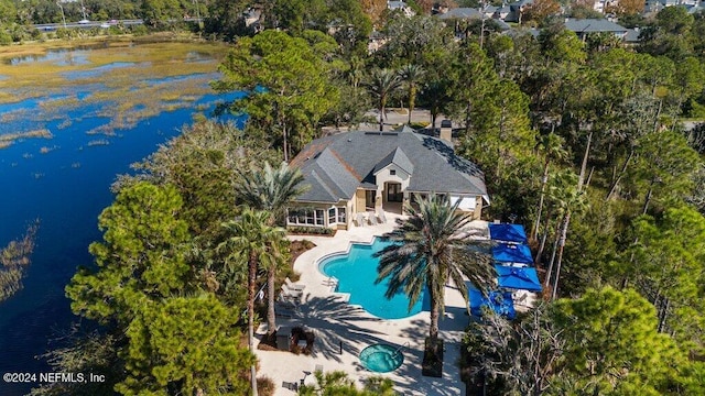 birds eye view of property with a water view