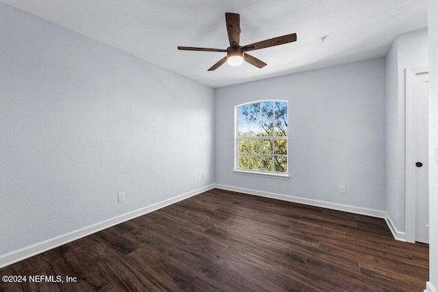 unfurnished room featuring dark hardwood / wood-style floors and ceiling fan