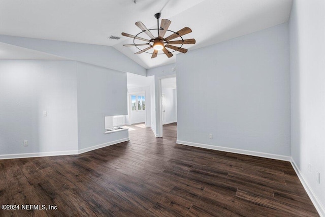 empty room featuring dark hardwood / wood-style floors, ceiling fan, and lofted ceiling