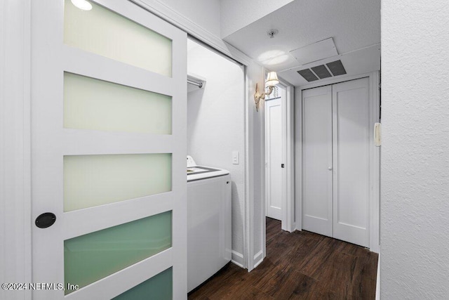 laundry room featuring dark hardwood / wood-style floors and washer / dryer