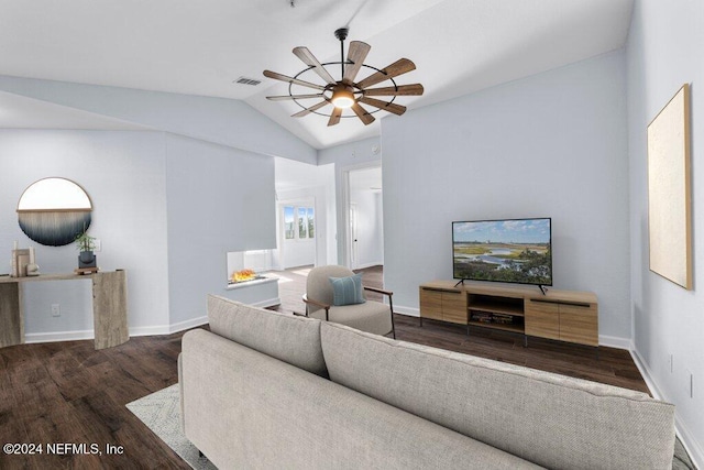 living room with ceiling fan, dark wood-type flooring, and vaulted ceiling