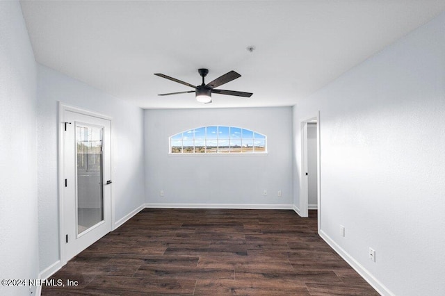 unfurnished room with ceiling fan and dark hardwood / wood-style floors