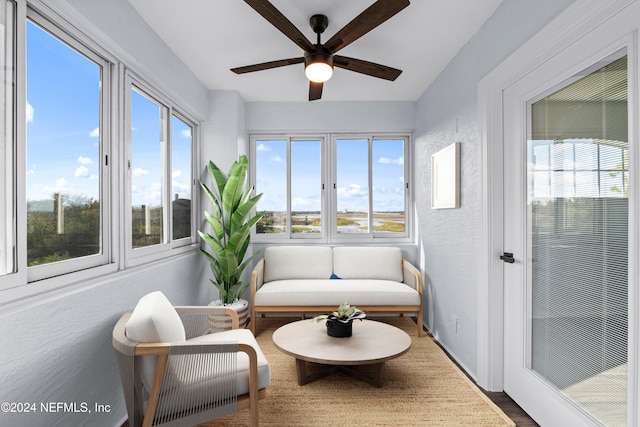 sunroom / solarium with ceiling fan