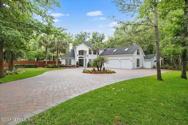 view of front facade with a garage and a front yard