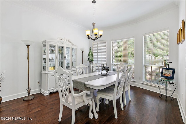 dining room with a chandelier, dark hardwood / wood-style flooring, and ornamental molding