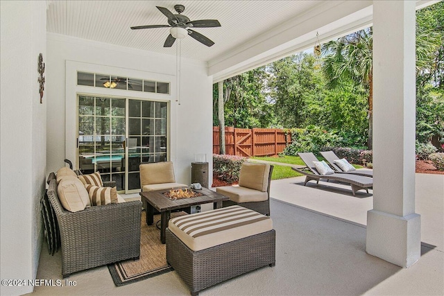 view of patio / terrace featuring an outdoor living space with a fire pit and ceiling fan