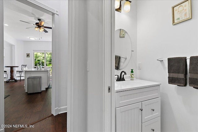 bathroom featuring vanity, hardwood / wood-style floors, and ceiling fan