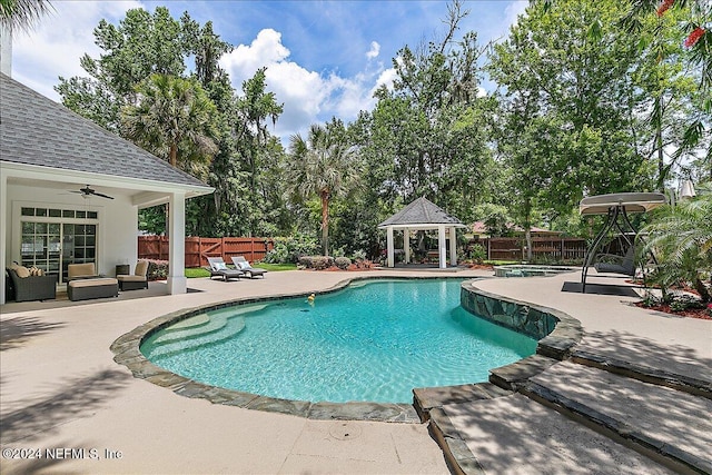 view of swimming pool featuring an outdoor hangout area, a patio area, and a gazebo