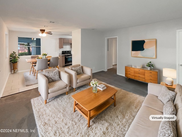 living room with carpet flooring and ceiling fan