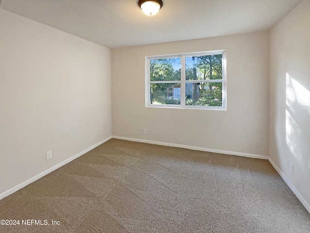 5225 Royce Ave, Jacksonville, FL 32205 - unfurnished room with carpet floors and baseboards