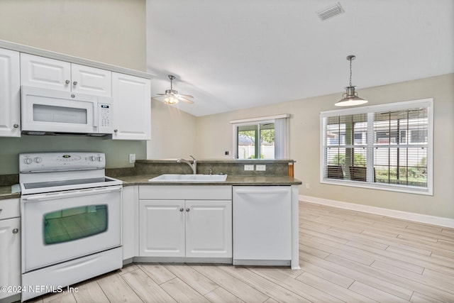 kitchen featuring white appliances, sink, light hardwood / wood-style floors, and white cabinets