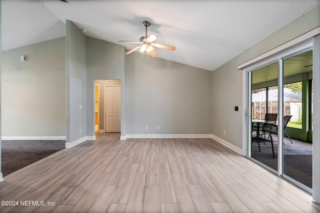 spare room with light hardwood / wood-style flooring, ceiling fan, and vaulted ceiling