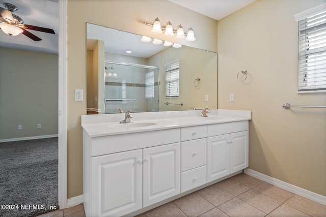 bathroom featuring vanity, ceiling fan, tile patterned floors, and a shower with door