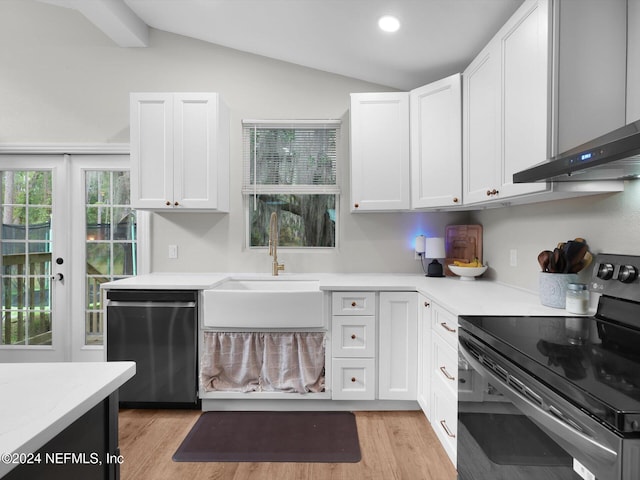 kitchen with light wood-type flooring, white cabinetry, electric range, stainless steel dishwasher, and lofted ceiling