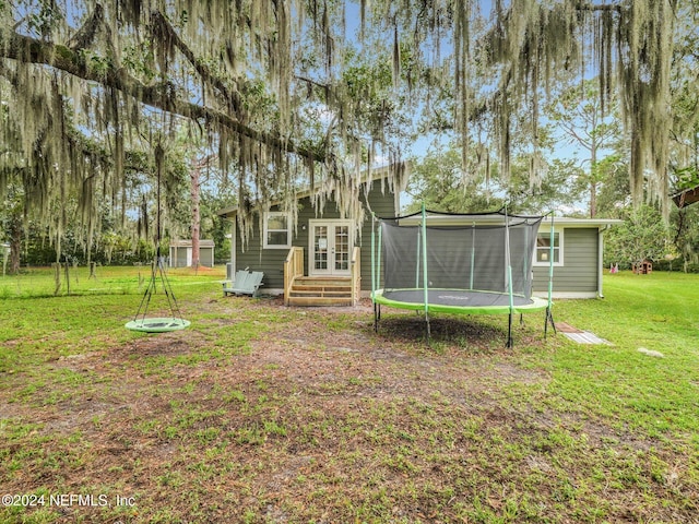 view of yard with a trampoline