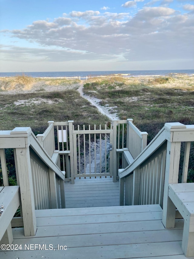 wooden deck with a water view