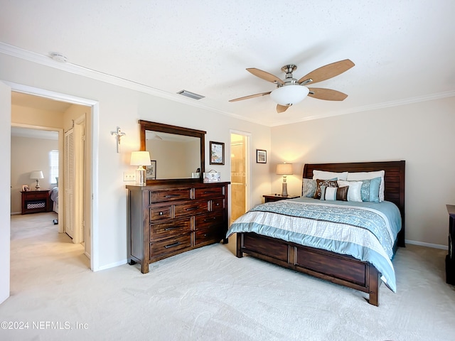 bedroom with ornamental molding, light carpet, and ceiling fan