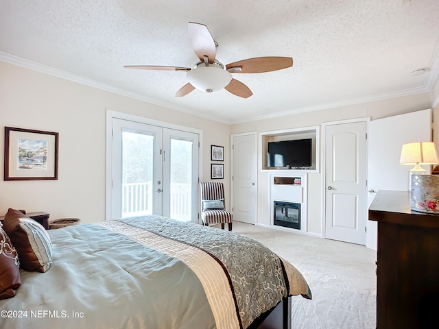 bedroom featuring access to exterior, a textured ceiling, light carpet, ceiling fan, and crown molding