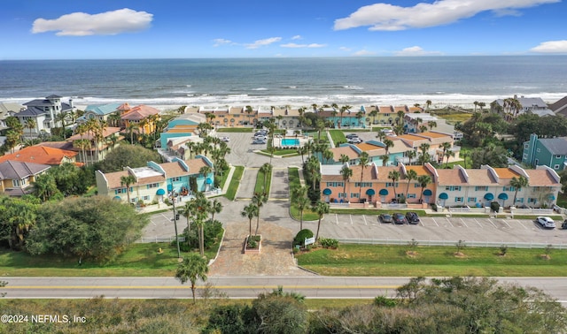 birds eye view of property featuring a view of the beach and a water view