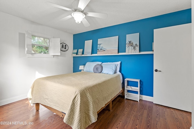 bedroom featuring ceiling fan and dark hardwood / wood-style flooring