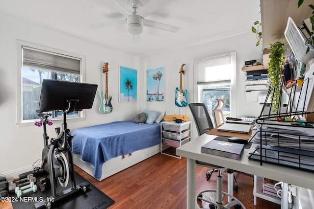 bedroom with ceiling fan and dark hardwood / wood-style floors