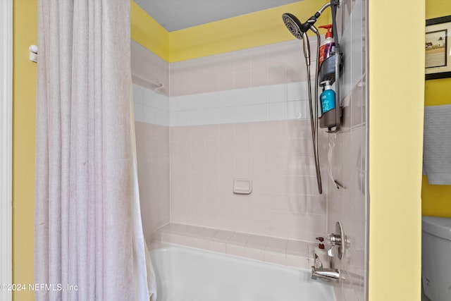 bathroom with shower / tub combo